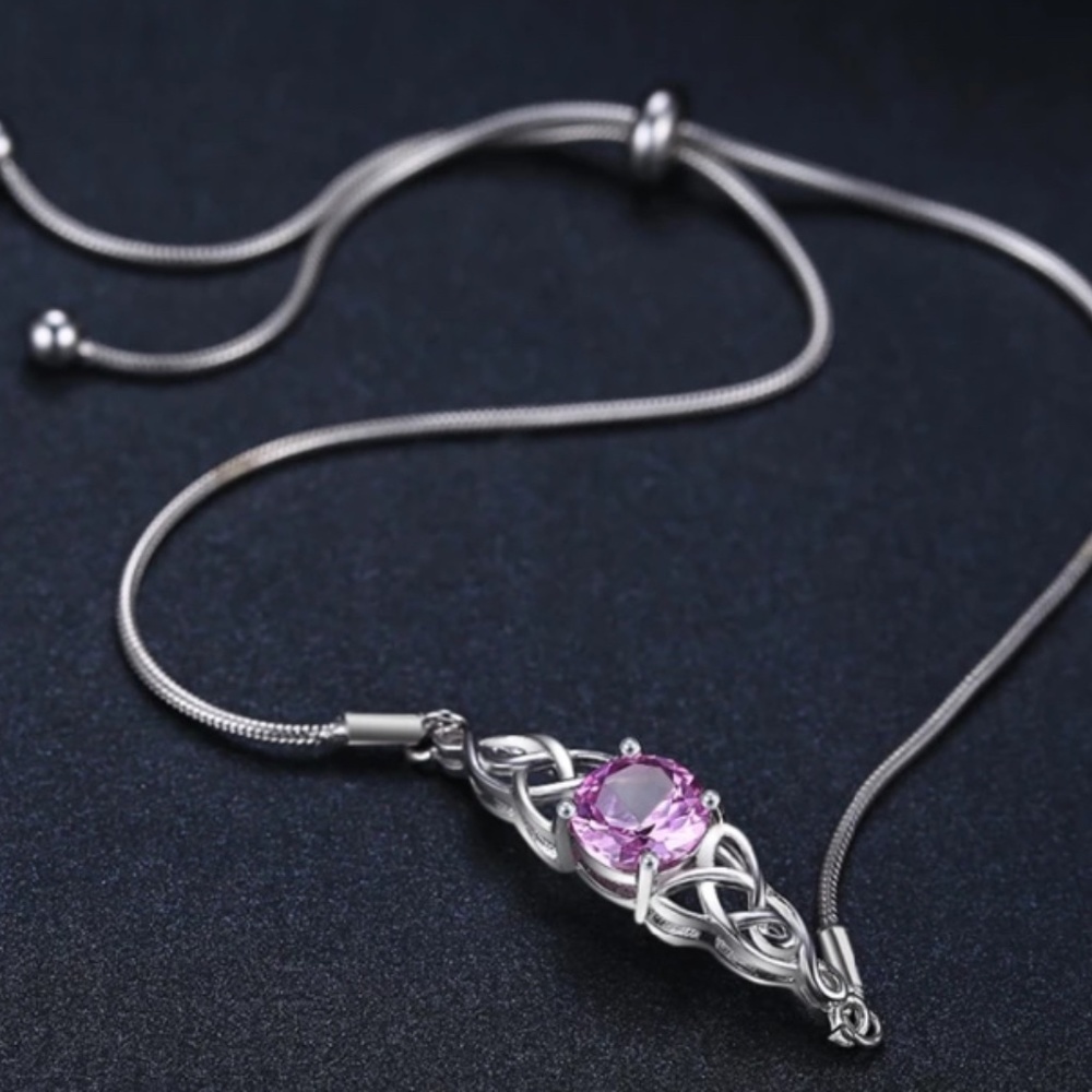Gorgeous Boho Silver O/S with  delicate scrollwork surrounding a pink gem.